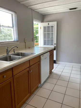 a kitchen with a sink and cabinets