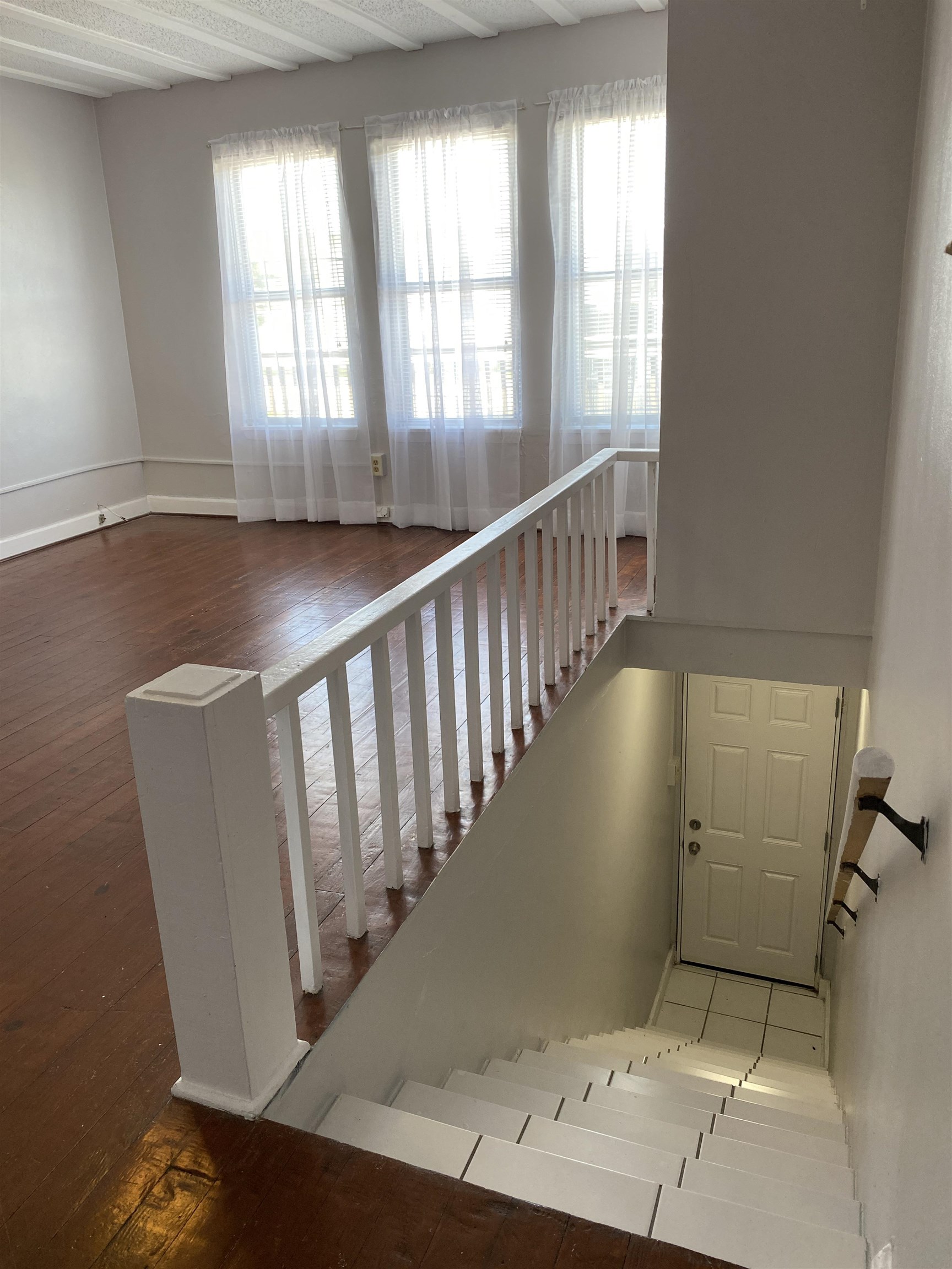 147 Riberia Street, Unit D St. Augustine, FL 32084 - Photo 8 of 19 a view of entryway with wooden floor