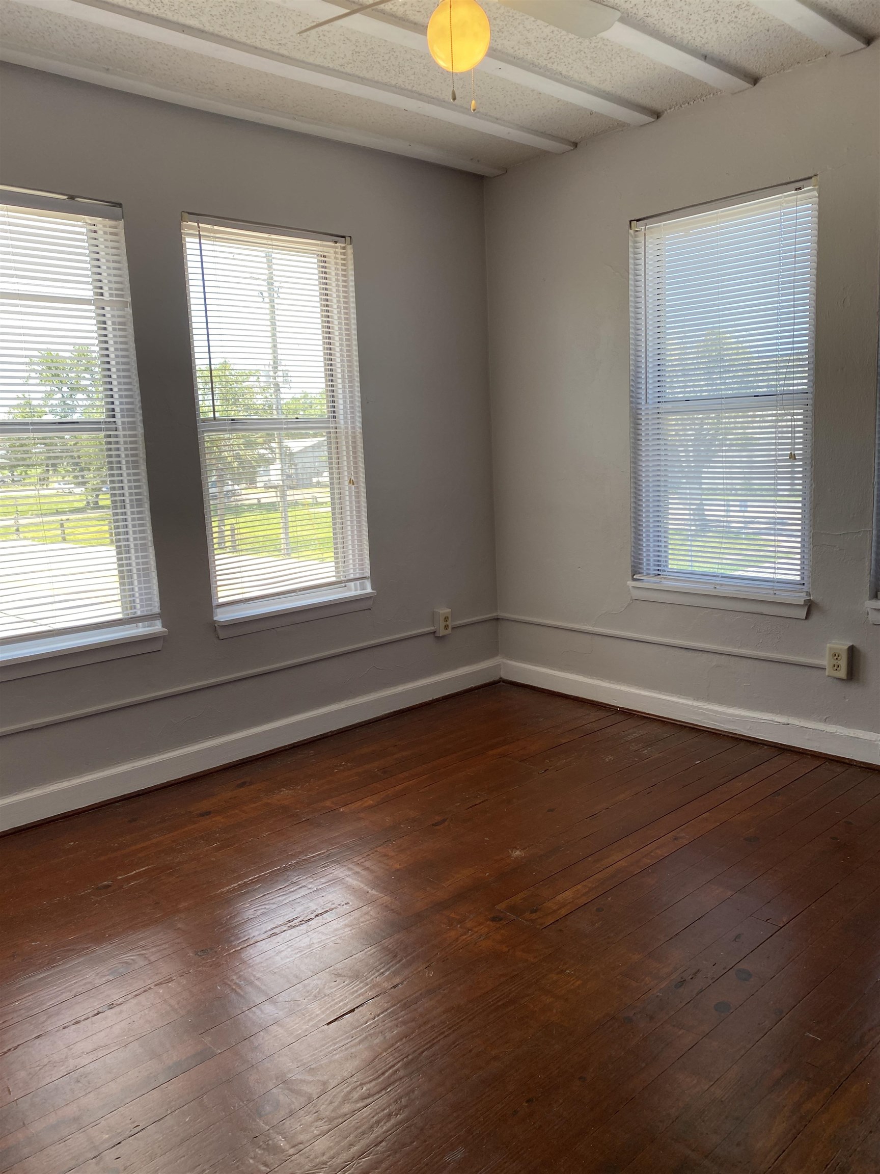 147 Riberia Street, Unit D St. Augustine, FL 32084 - Photo 10 of 19 an empty room with wooden floor and windows