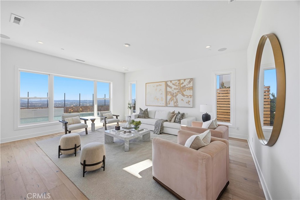 20138 Marlow Lane Porter Ranch, CA 91326 - Photo 8 of 39 a living room with furniture and a large window