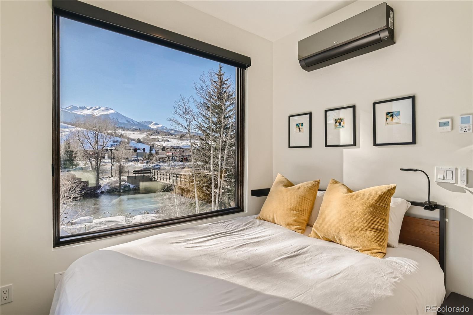 46 6th Street Silverthorne, CO 80498 - Photo 14 of 28 a bedroom with a large bed and a window