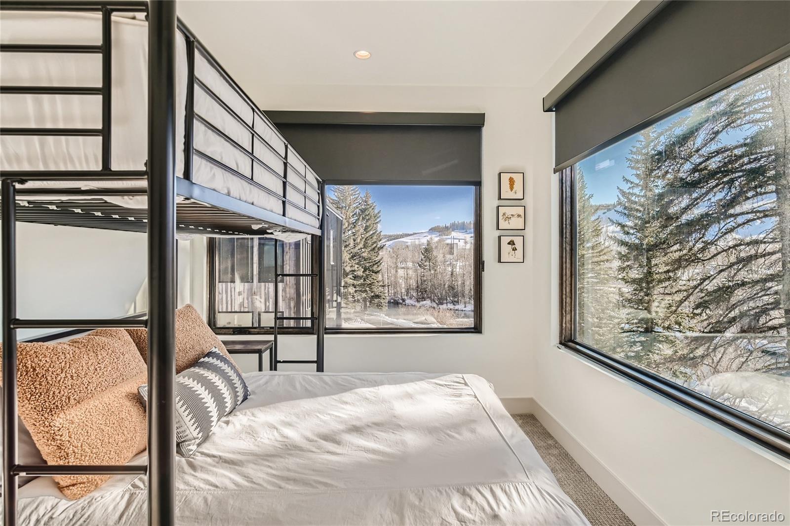 46 6th Street Silverthorne, CO 80498 - Photo 20 of 28 a bedroom with a bed and a painting on the wall