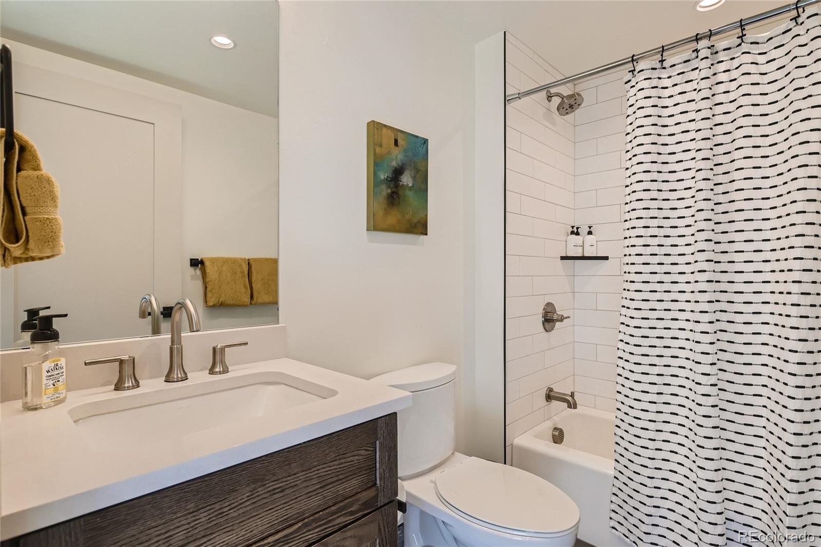 46 6th Street Silverthorne, CO 80498 - Photo 21 of 28 a bathroom with a sink toilet and shower