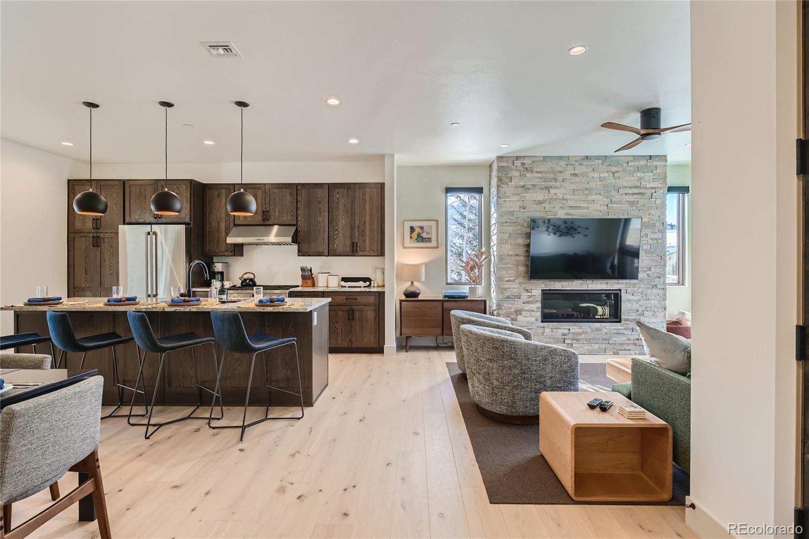 46 6th Street Silverthorne, CO 80498 - Photo 5 of 28 a living room with furniture and a flat screen tv