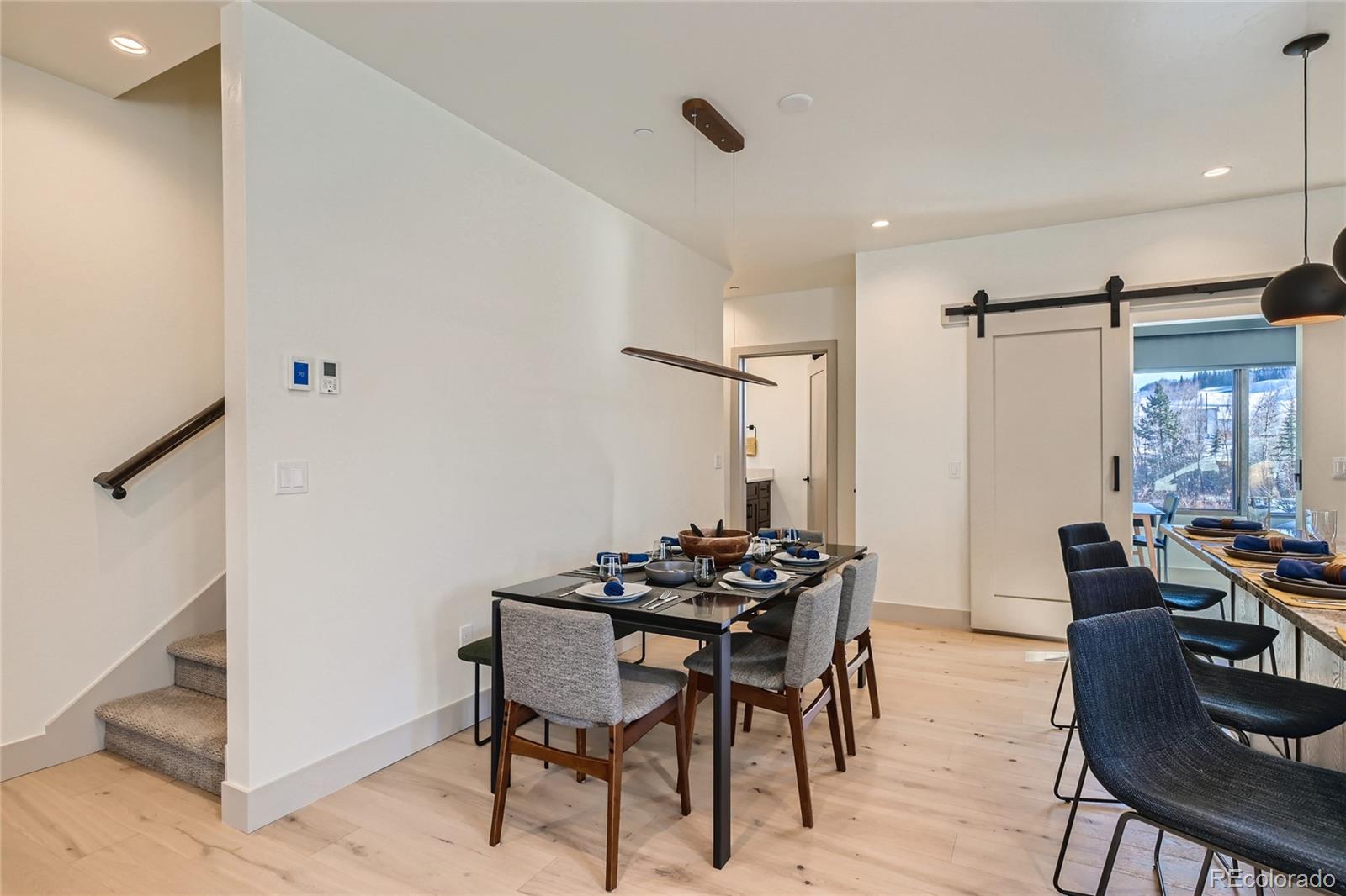 46 6th Street Silverthorne, CO 80498 - Photo 8 of 28 a dining room with furniture and window