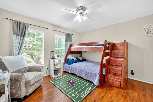 a bedroom with a bed and a chair