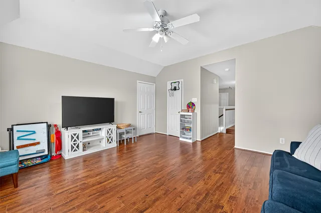 a view of livingroom with hardwood floor and flat screen tv
