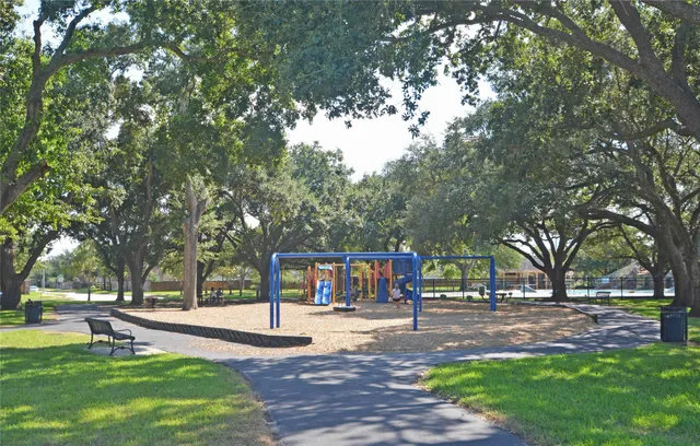 a view of outdoor space with garden and trees