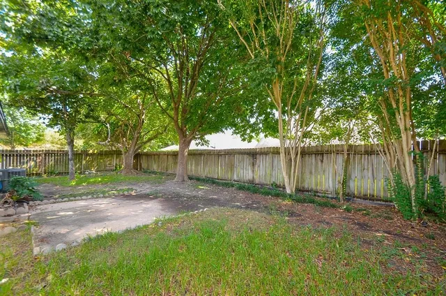 a view of an empty room with a bathroom