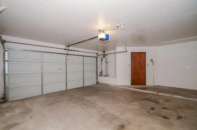 a view of an empty room with staircase