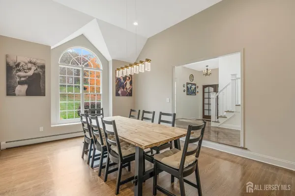 a view of a dining room with furniture window and outside view
