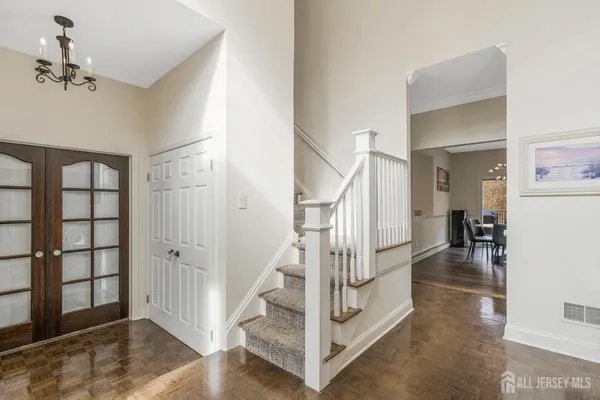 a view of entryway and hall with a living room