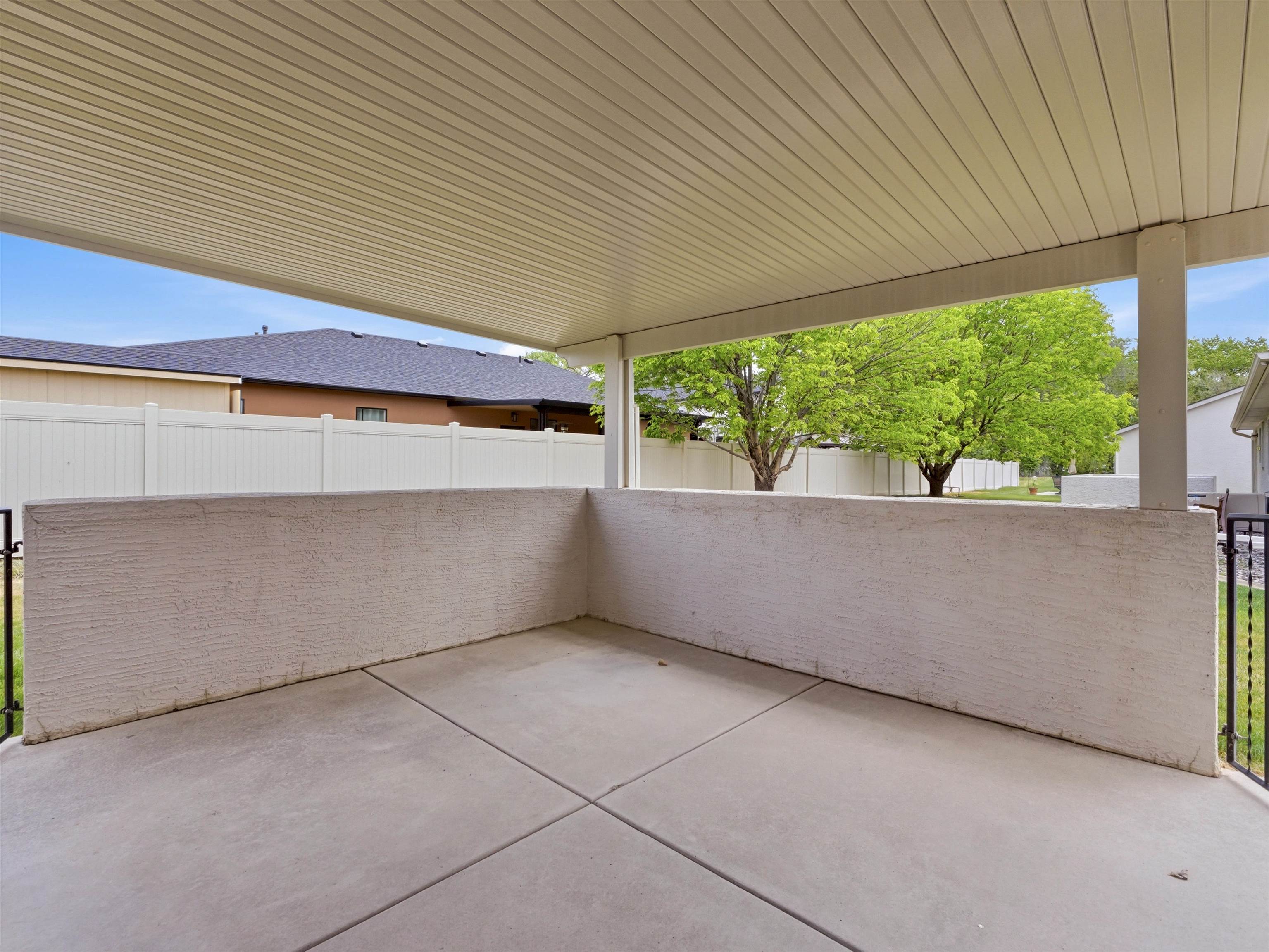 3082 Shadowbrook Court Grand Junction, CO 81504 - Photo 24 of 28 a view of a patio with table and chairs under an umbrella