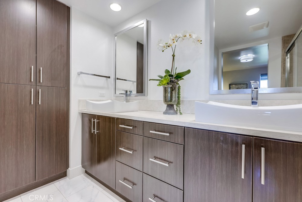 59 Gramercy Irvine, CA 92612 - Photo 33 of 71 a bathroom with a sink and a mirror