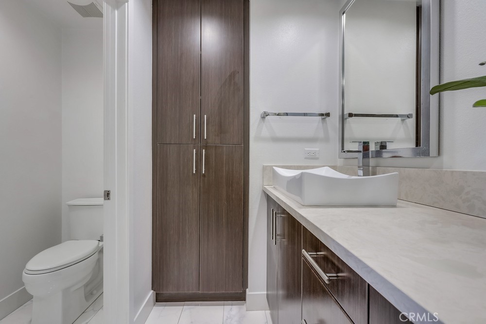 59 Gramercy Irvine, CA 92612 - Photo 35 of 71 a bathroom with a sink and a toilet