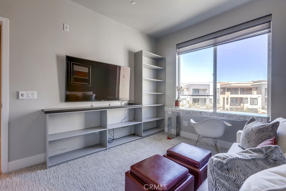 59 Gramercy Irvine, CA 92612 - Photo 40 of 71 a living room with a couch and a flat screen tv