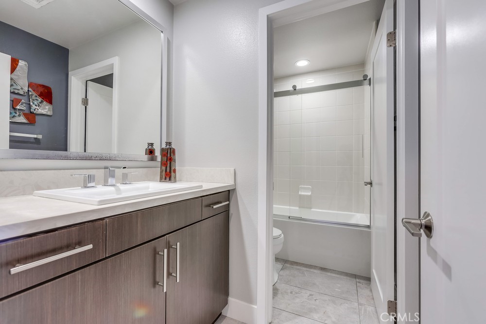 59 Gramercy Irvine, CA 92612 - Photo 42 of 71 a bathroom with a sink and a mirror