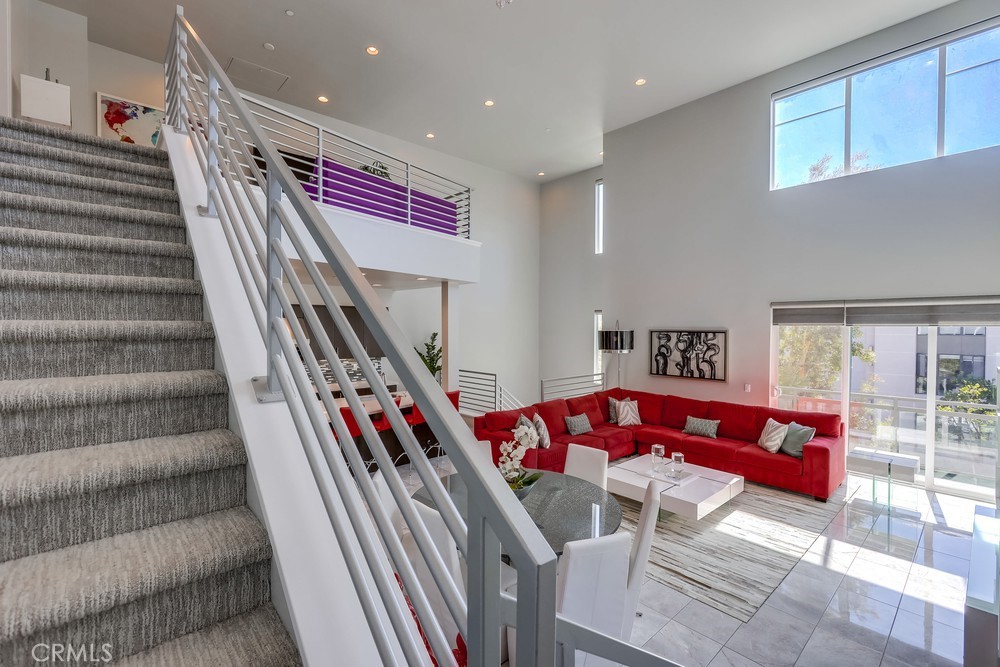 59 Gramercy Irvine, CA 92612 - Photo 45 of 71 a living room with furniture and stairs