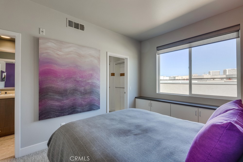 59 Gramercy Irvine, CA 92612 - Photo 52 of 71 a bedroom with a bed and a large window