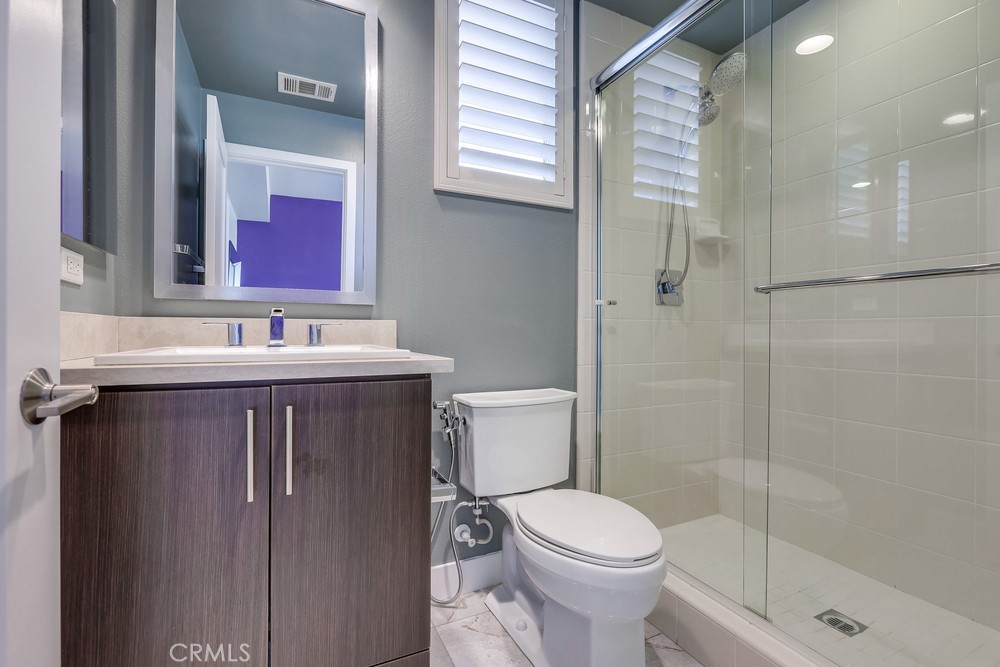 59 Gramercy Irvine, CA 92612 - Photo 55 of 71 a bathroom with a sink a toilet and shower
