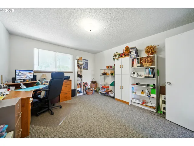 a workspace with furniture and window