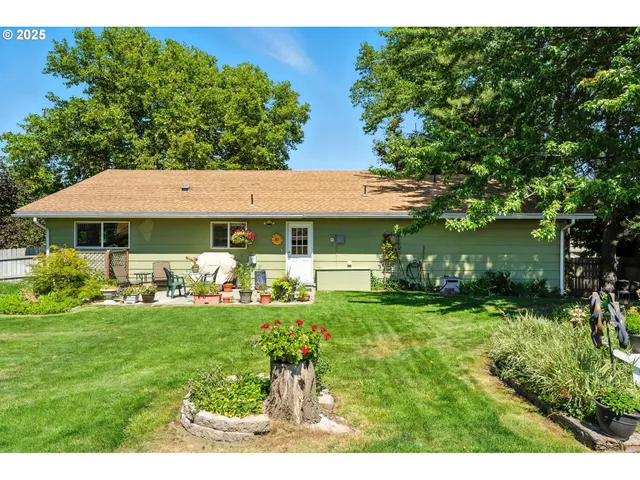 a view of a house with a yard porch and sitting area