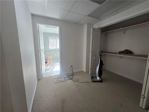 a room with a bed and a window