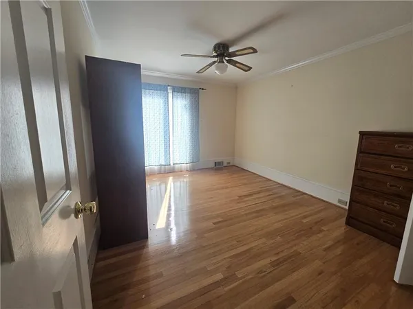 a bathroom with a toilet and shower