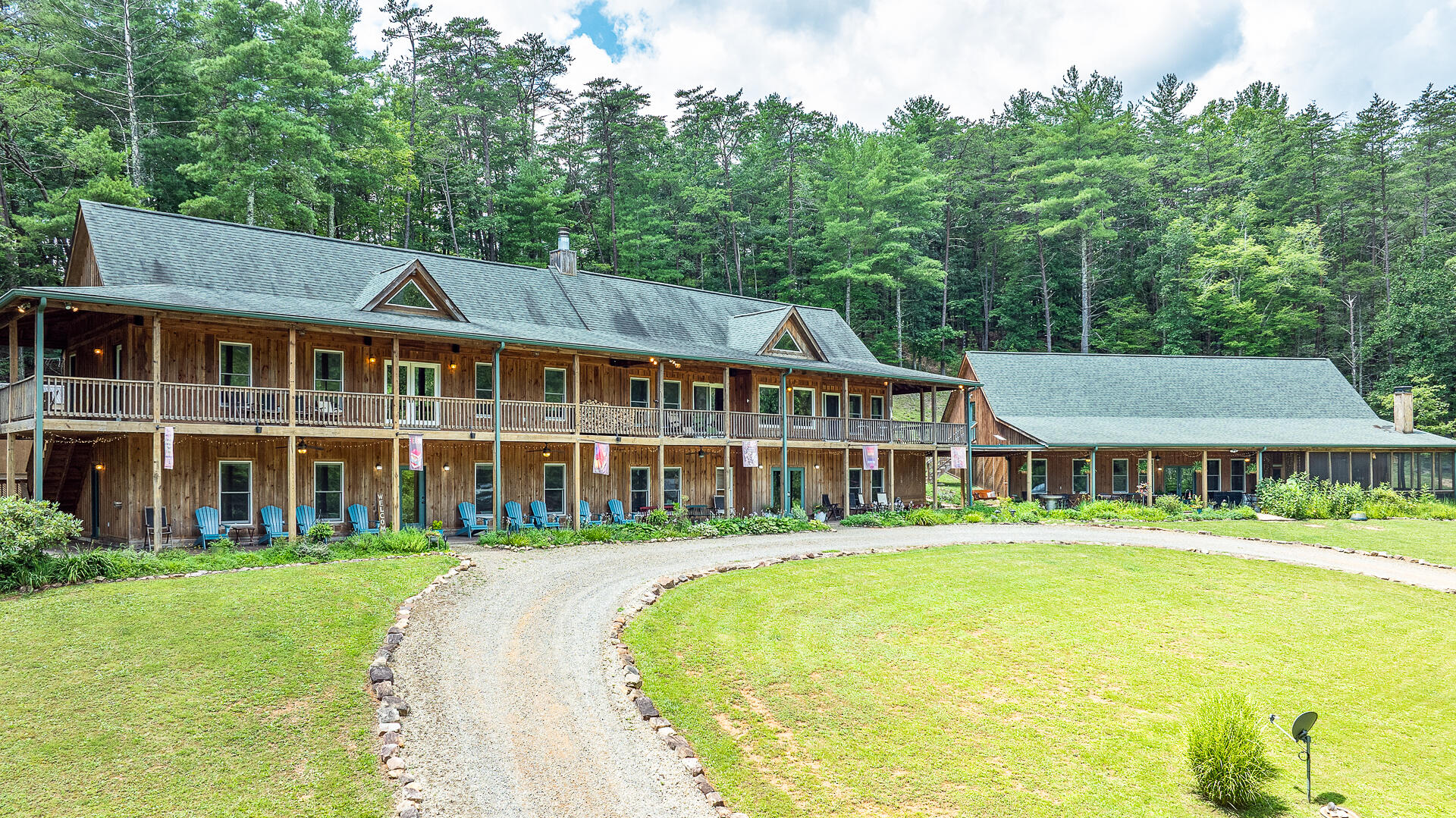 57 Hemlock Ridge Lane Catawba, VA 24070 - Photo 2 of 89 a front view of a building with a garden and trees