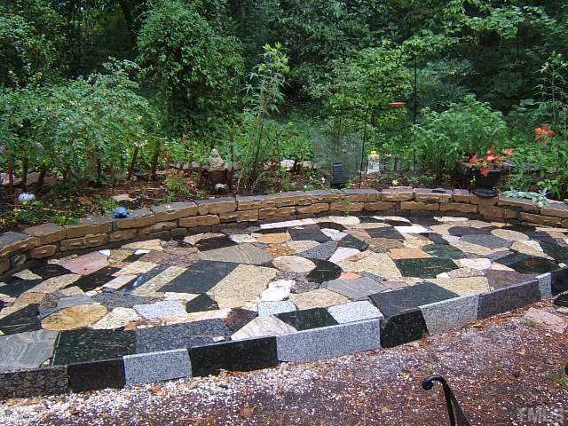 1213 Lorimer Road Raleigh, NC 27606 - Photo 11 of 20 Granite patio for enjoying this incredible & private wooded lot.