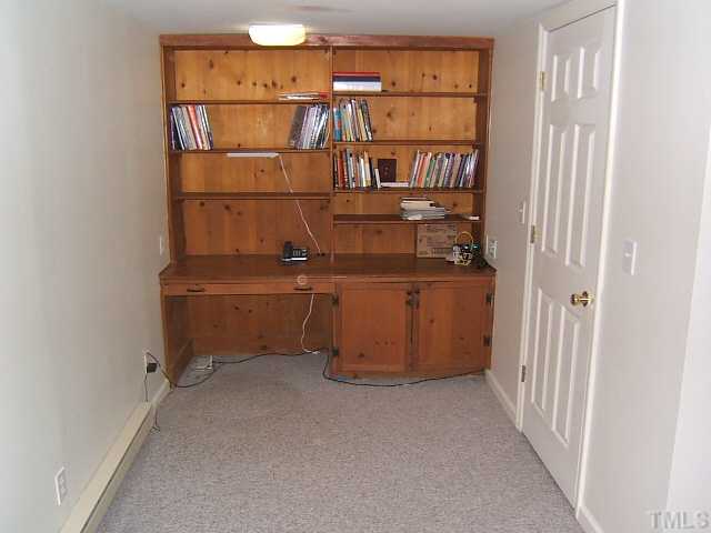1213 Lorimer Road Raleigh, NC 27606 - Photo 20 of 20 Office nook with built-n desk, cabinets & bookshelves.