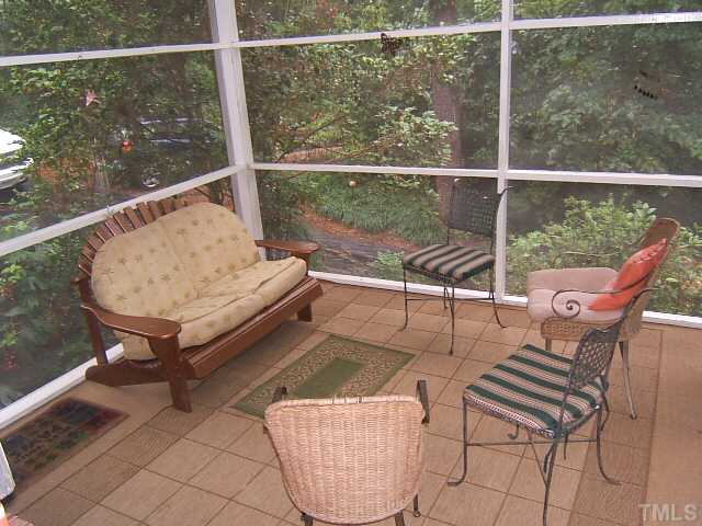 1213 Lorimer Road Raleigh, NC 27606 - Photo 2 of 20 Screened porch overlooking a wooded view!