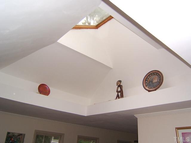 1213 Lorimer Road Raleigh, NC 27606 - Photo 3 of 20 Skylight and decorative shelf adds light and space to this older home.
