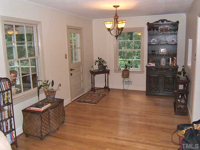 1213 Lorimer Road Raleigh, NC 27606 - Photo 8 of 20 Dining Room with hardwood floors open to Living Room.