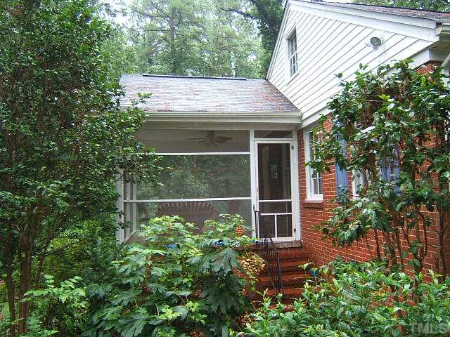 1213 Lorimer Road Raleigh, NC 27606 - Photo 9 of 20 Private Screened Porch overlooks a serene wooded view.