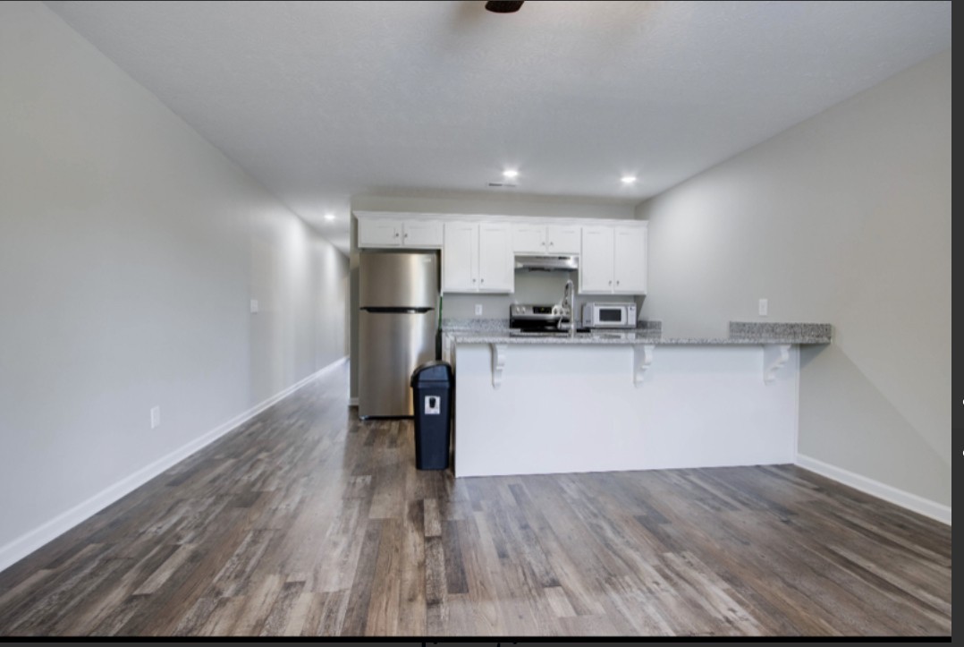 113 Bright Avenue Carthage, TN 37030 - Photo 5 of 14 a view of a kitchen with a sink and wooden floor