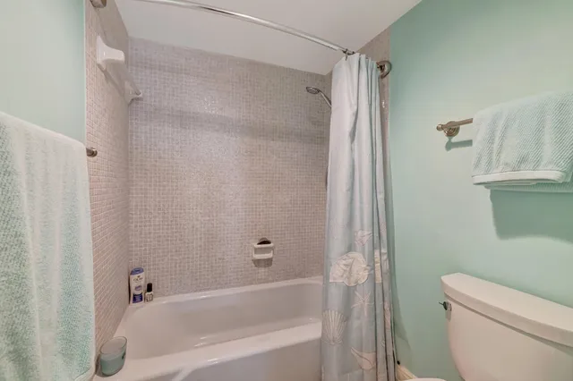 a spacious bathroom with a double vanity sink and a mirror