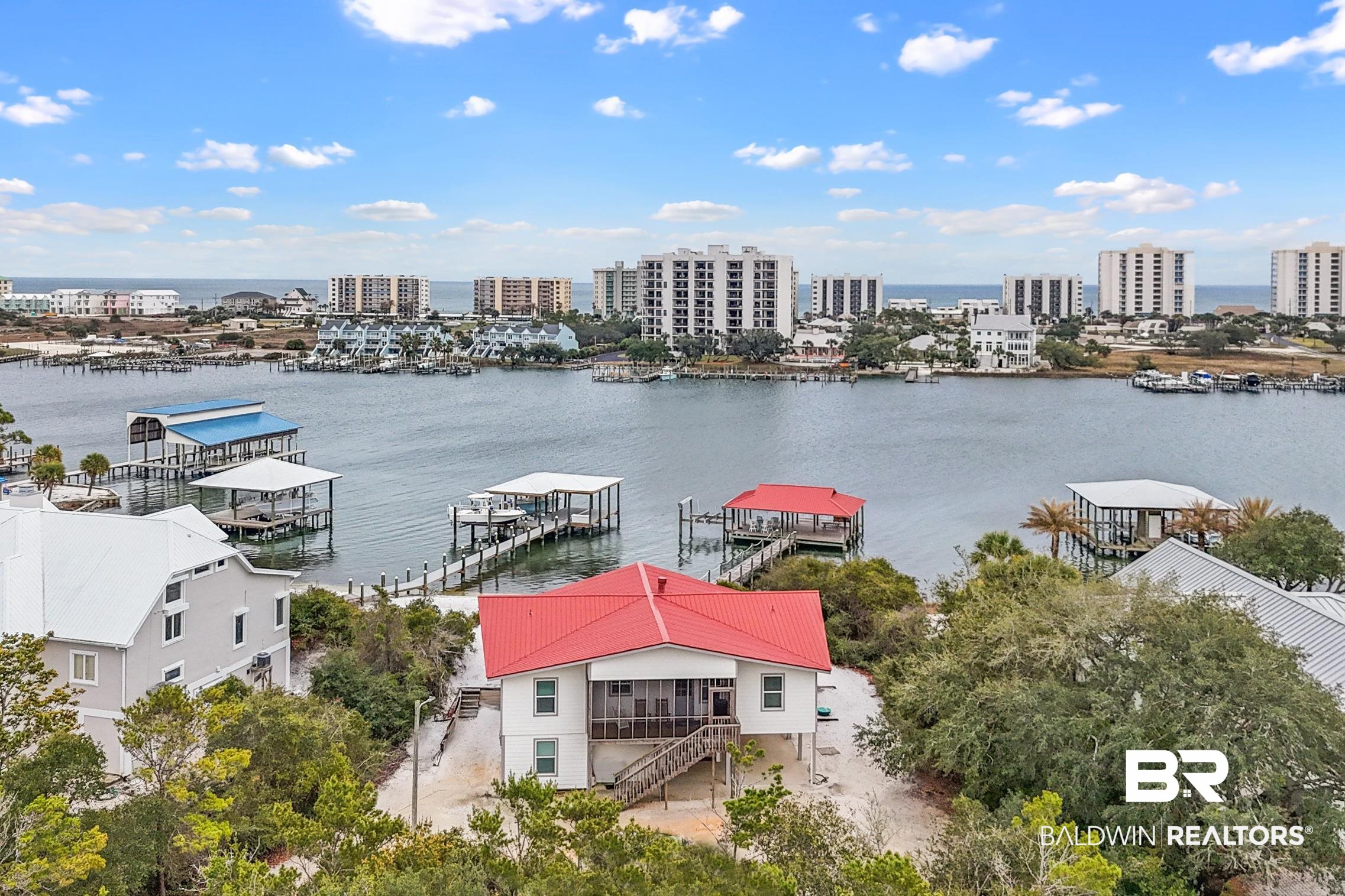 30388 River Road Orange Beach, AL 36561 - Photo 5 of 72 Property view of water with a dock and a city view