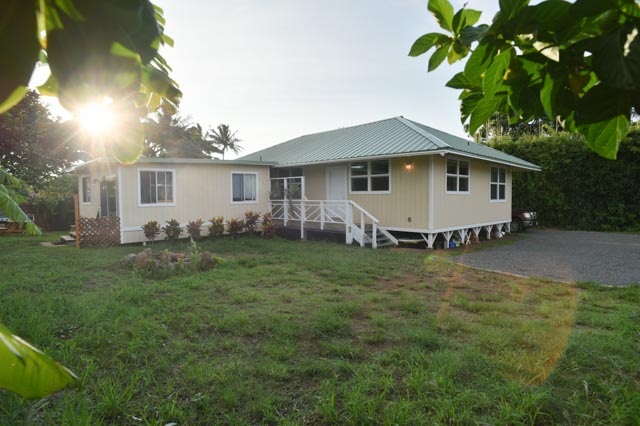 690 Haiku Road Haiku, HI 96708 - Photo 1 of 1 a view of a house with a yard and a garden