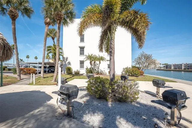 a view of a swimming pool and lounge chairs