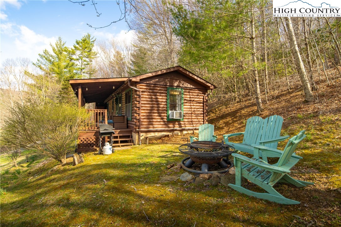 2408 Todd Railroad Grade Road Todd, NC 28684 - Photo 37 of 46 a backyard of a house with table and chairs