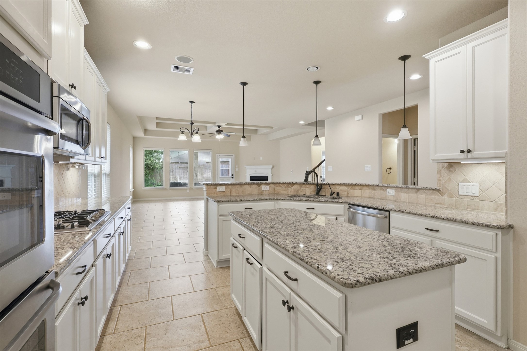 22943 Dale River Road Tomball, TX 77375 - Photo 8 of 29 a kitchen with stainless steel appliances granite countertop a sink stove and refrigerator