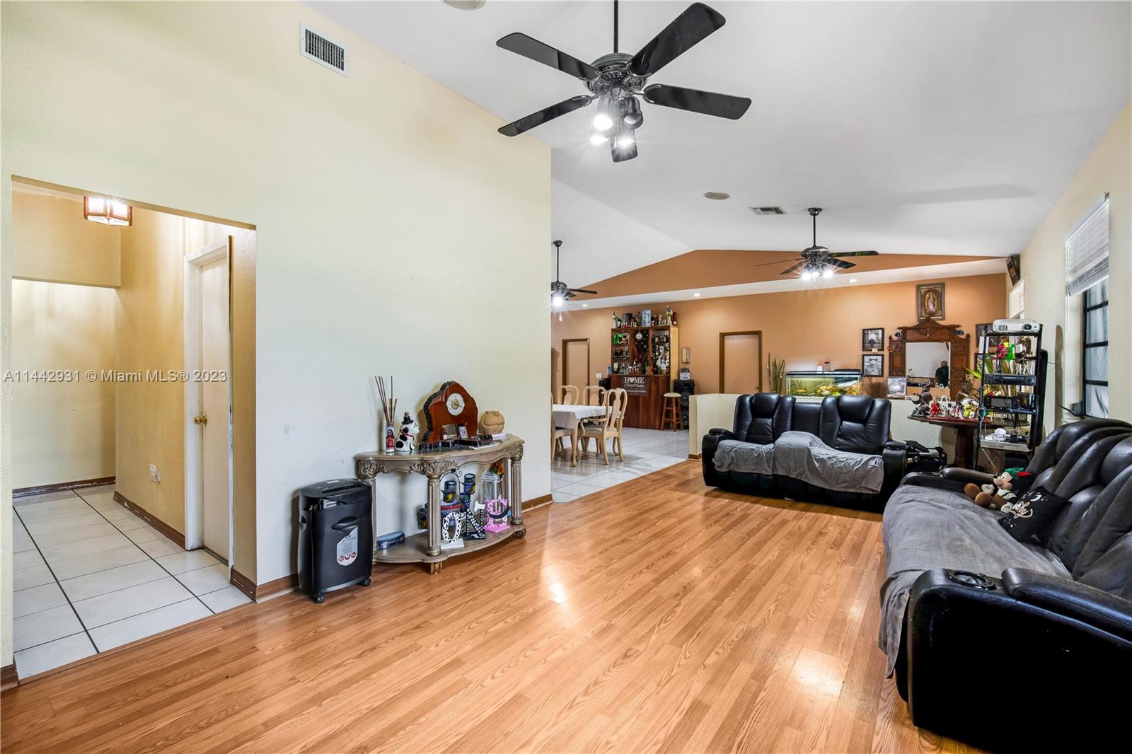 18475 Southwest 206th Street Miami, FL 33187 - Photo 15 of 49 a living room with furniture and a large window