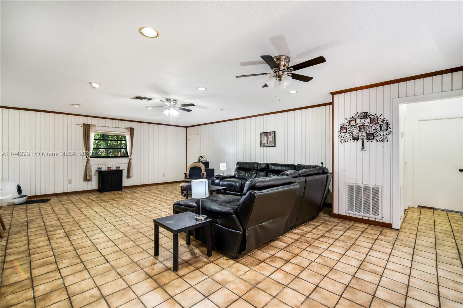 18475 Southwest 206th Street Miami, FL 33187 - Photo 30 of 49 a living room with furniture
