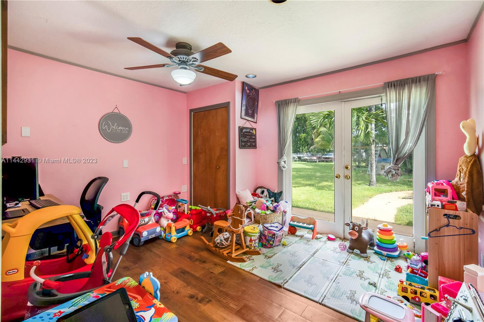 18475 Southwest 206th Street Miami, FL 33187 - Photo 33 of 49 a bedroom with furniture toys and a large window