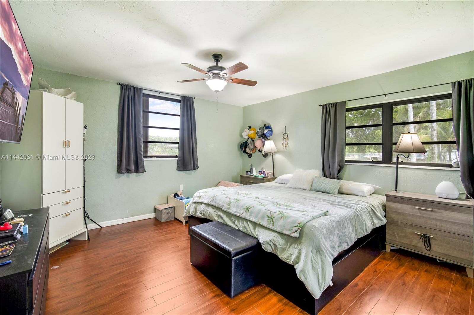 18475 Southwest 206th Street Miami, FL 33187 - Photo 34 of 49 a bedroom with a bed dresser and a window