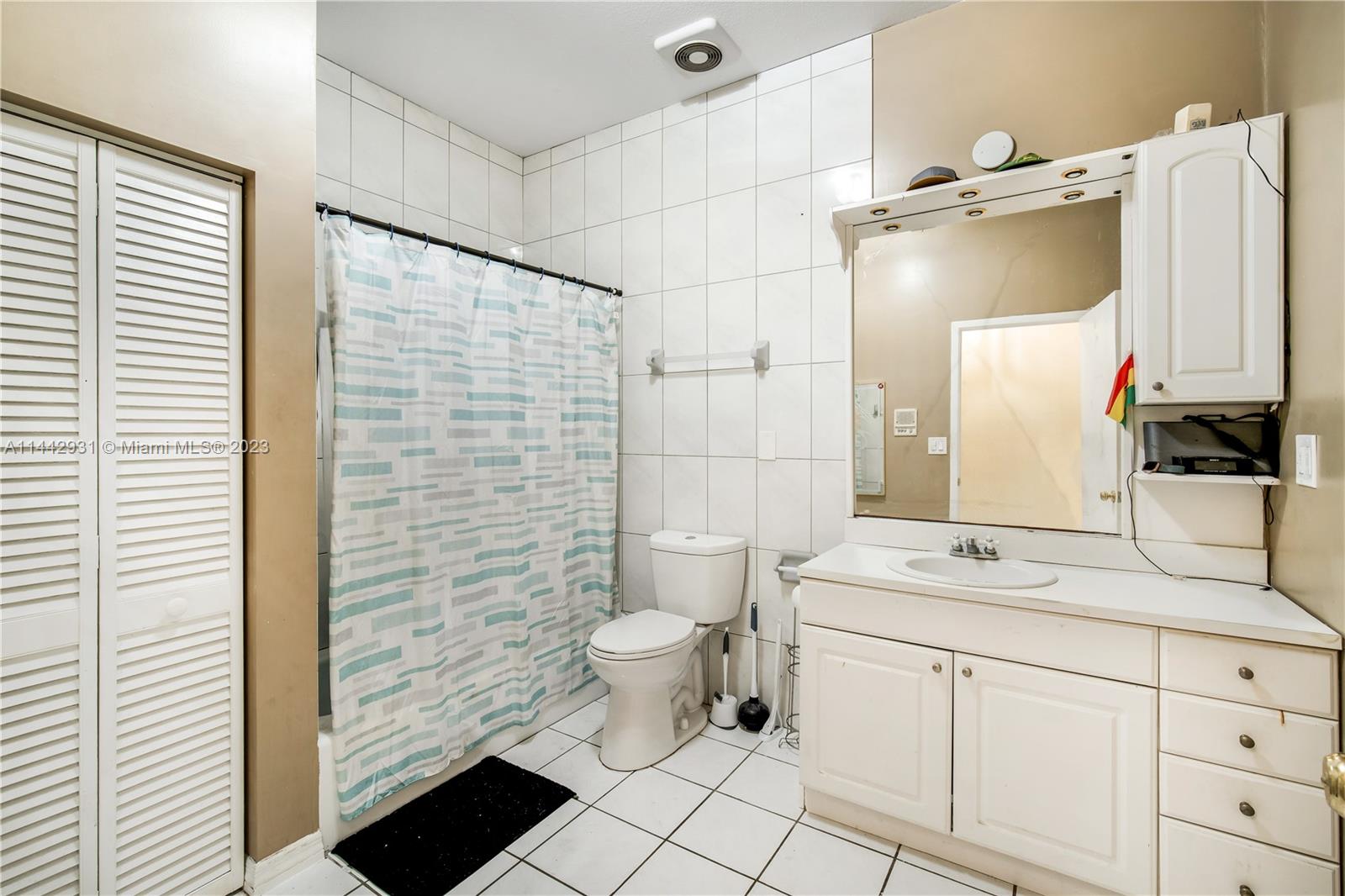 18475 Southwest 206th Street Miami, FL 33187 - Photo 38 of 49 a bathroom with a sink toilet and shower