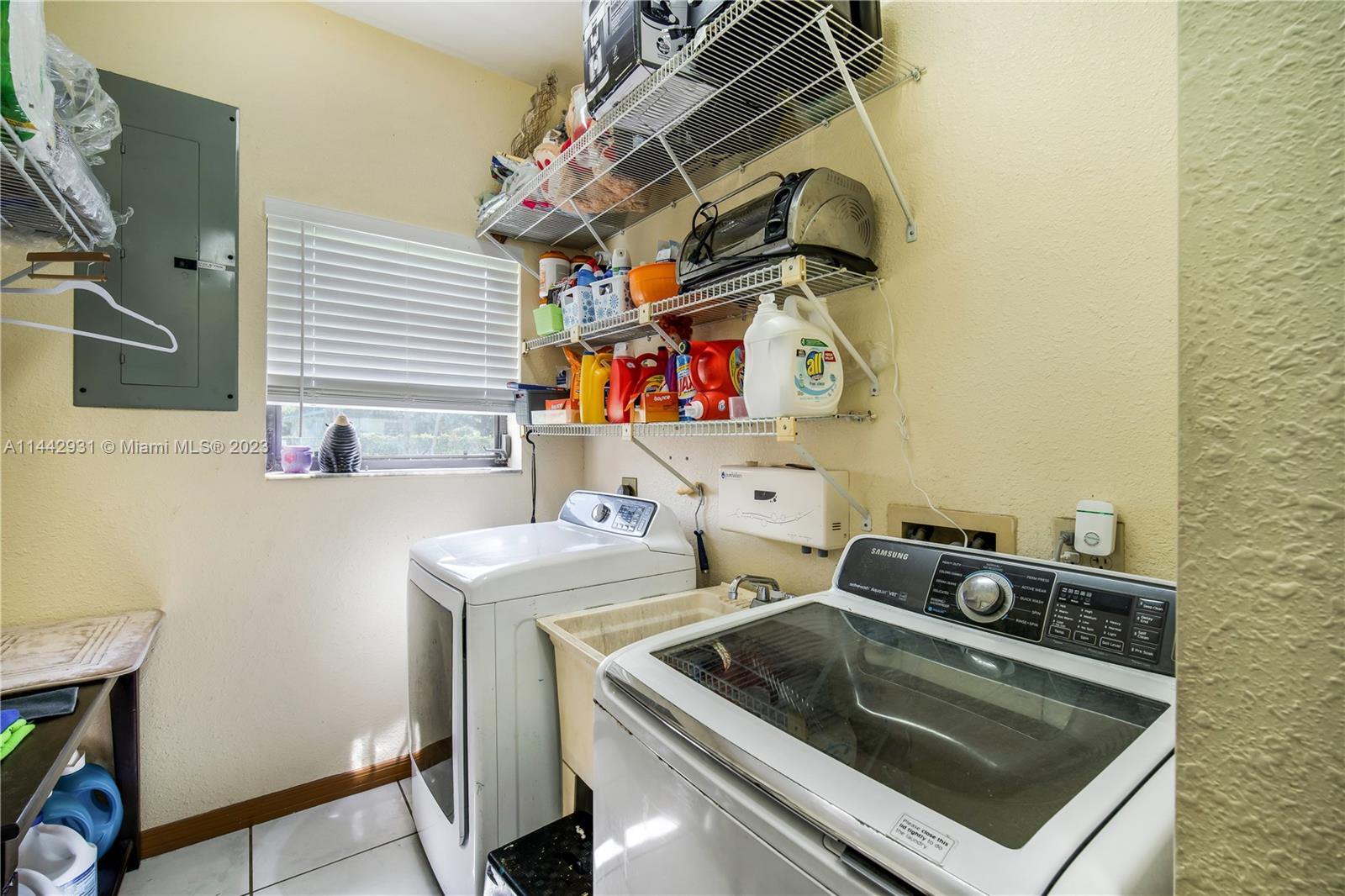 18475 Southwest 206th Street Miami, FL 33187 - Photo 39 of 49 a utility room with dryer and washer