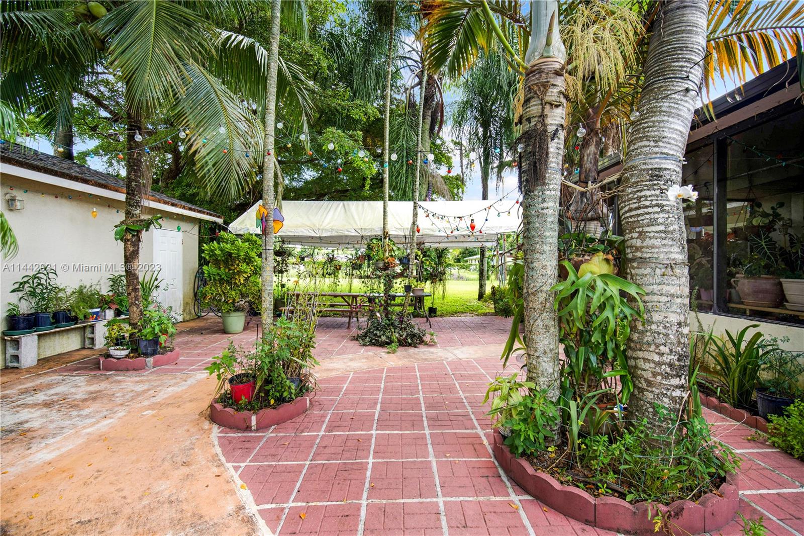 18475 Southwest 206th Street Miami, FL 33187 - Photo 41 of 49 a view of a garden with sitting area