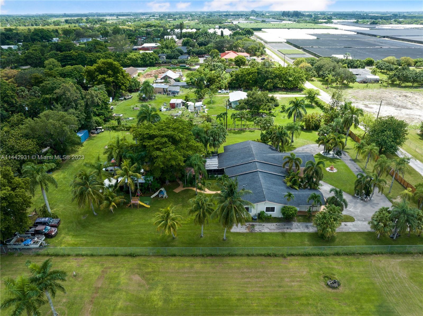 18475 Southwest 206th Street Miami, FL 33187 - Photo 45 of 49 a view of a house with a yard